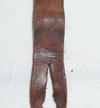 Brass and leather frog adapter tab for retaining a No.4 scabbard in a P37 frog.
