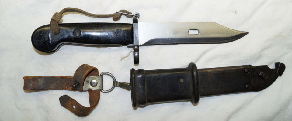 AKM sawback/wire cutter Bayonet with scabbard and frog and hand lanyard.