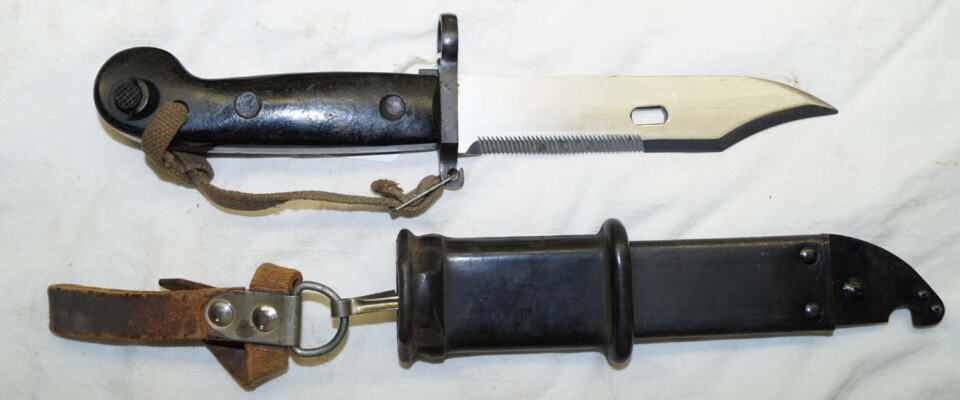 AKM sawback/wire cutter Bayonet with scabbard and frog and hand lanyard.