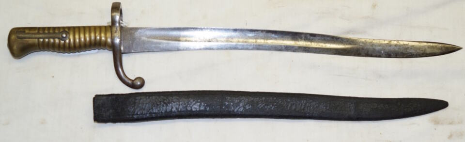 Comblain Cadet bayonet with leather scabbard remnant.