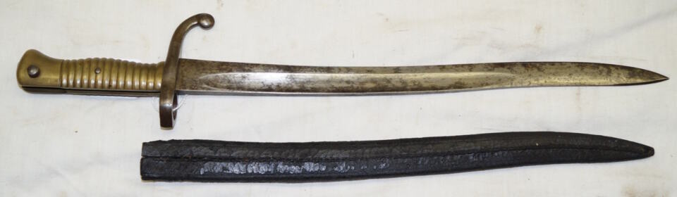 Comblain Cadet bayonet with leather scabbard remnant.