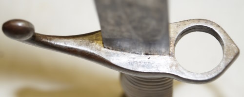 Comblain Cadet bayonet with leather scabbard remnant.