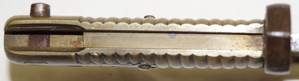 Comblain Cadet bayonet with leather scabbard remnant.