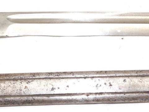 Ersatz bayonet with scabbard and wood grip inserts.