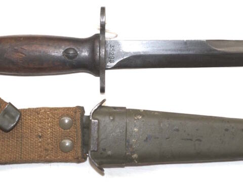 Italian produced M4 bayonet with Leather scabbard and wooden grips.